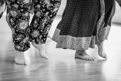 Low section of women standing on floor