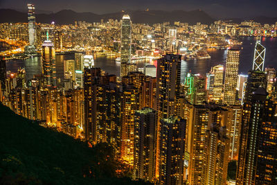 High angle view of illuminated buildings in city at night