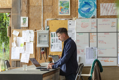 Man looking at laptop in office