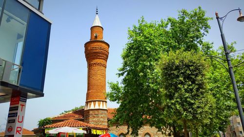 Low angle view of tower against blue sky