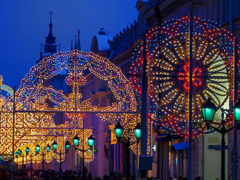 Illuminated decoration by church at dusk