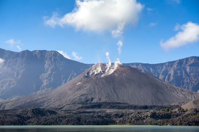 Landscape with mountain range in the background