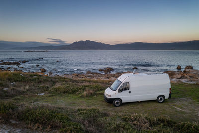 Camper van motorhome with solar panels drone aerial view living van life in galiza, spain