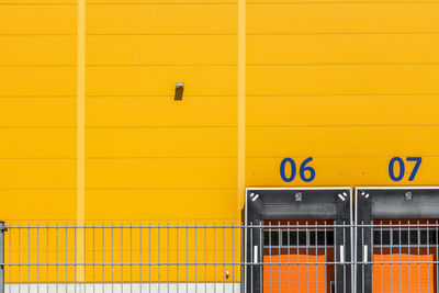 Numbers on yellow wall