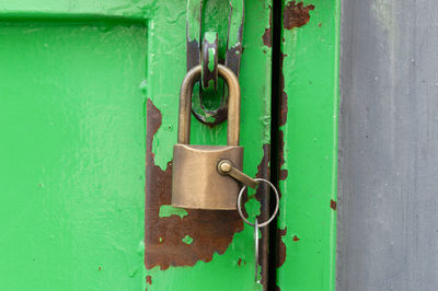 Close-up of padlock on blue door