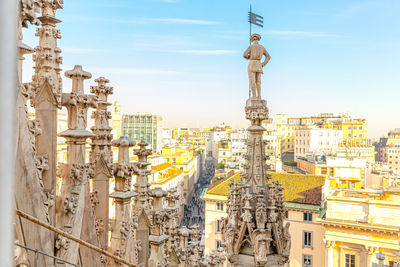 View of city buildings against sky