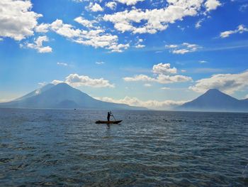 Scenic view of sea against blue sky