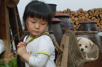 A walking girl and a dog.