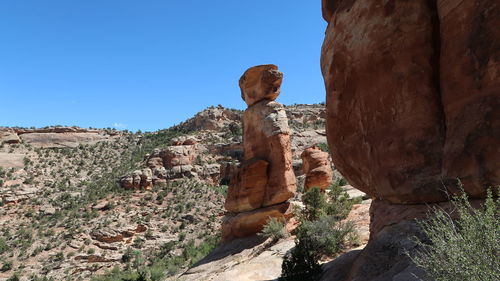 Rock formations on mountain against sky