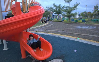 Rear view of girl on playground