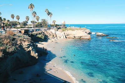 Scenic view of beach against blue sky