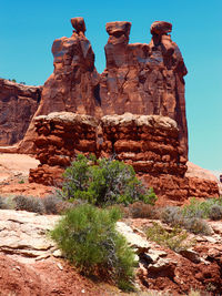 Low angle view of rock formation against clear sky