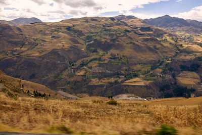 Scenic view of landscape and mountains against sky