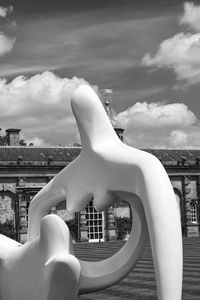 Close-up of statue against sky in city