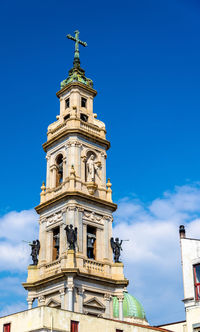 Low angle view of building against blue sky