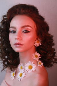 Side view portrait of teenage girl wearing flowers