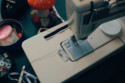 High angle view of sewing machine on table