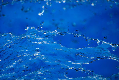 Full frame shot of water drops on blue sky