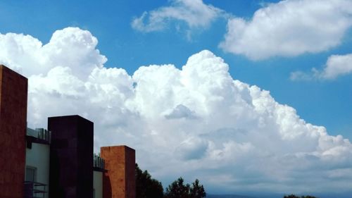 Low angle view of building against blue sky