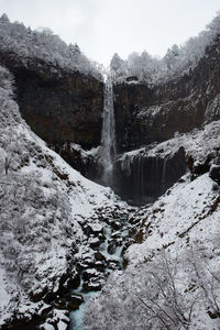 Waterfall in forest during winter