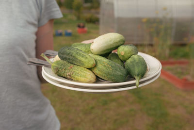 Midsection of man holding food