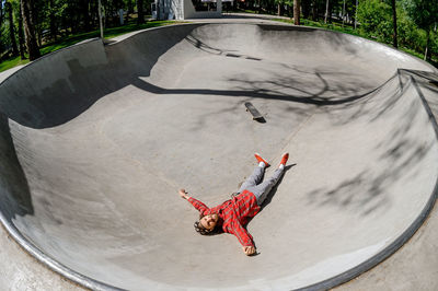 Low section of man skateboarding on skateboard