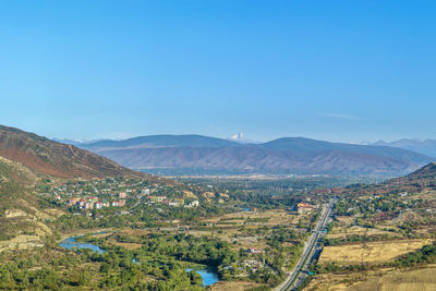 View of aragvi valley from jvari monastery hill, georgia. on the horizon is visible mount kazbek