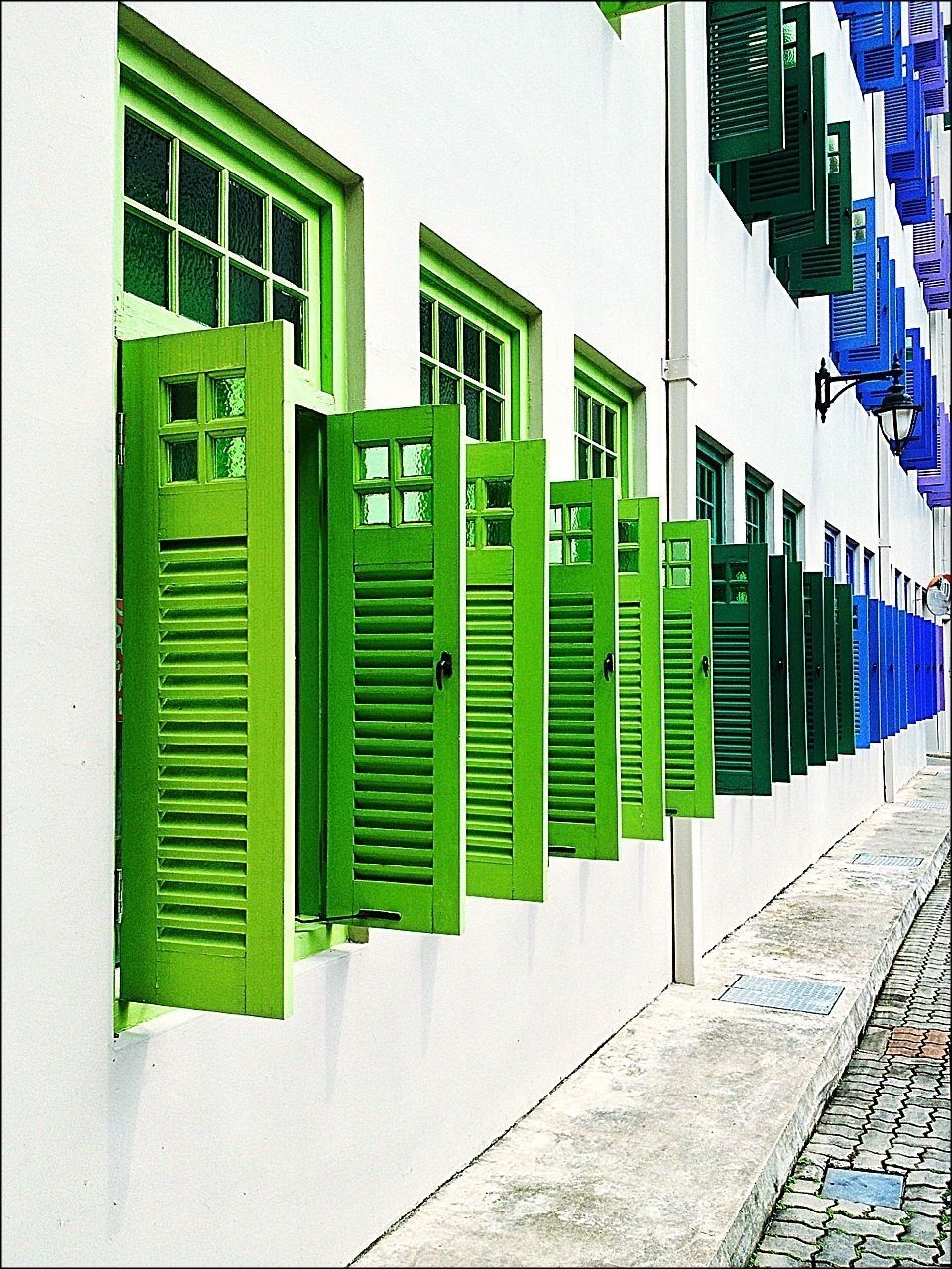 building exterior, architecture, built structure, multi colored, in a row, city, window, building, day, auto post production filter, repetition, residential structure, transfer print, closed, outdoors, pattern, side by side, wall - building feature, residential building, no people