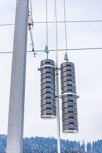 Low angle view of street light against building