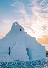 Scenic view of frozen lake against sky during sunset