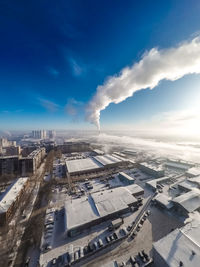 High angle view of buildings in city against sky