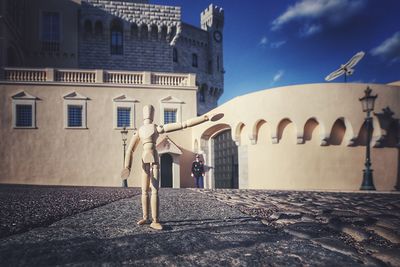 Woman standing in front of building