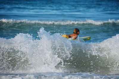 Waves in sea splashing at shore