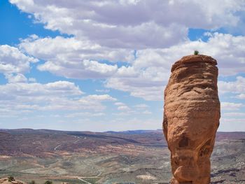 Rock formations on landscape against sky