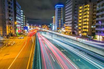 High angle view of light trails on city at night