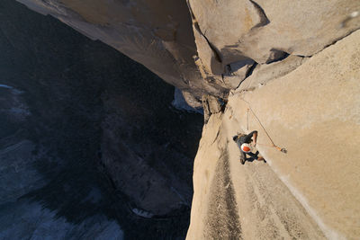 Rock climber crack climbing on the nose, el capitan in yosemite