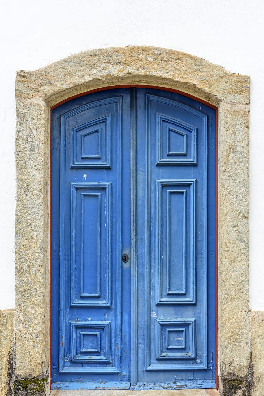 entrance, door, closed, architecture, blue, built structure, building, building exterior, house, protection, wood - material, no people, front door, safety, security, residential district, day, doorway, wall - building feature, close-up, outdoors, ornate