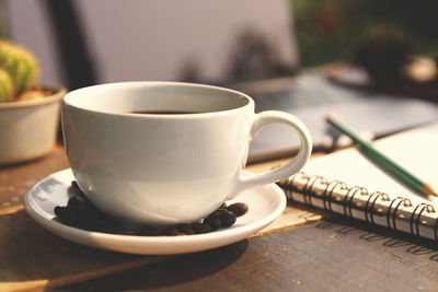 Close-up of coffee cup on table