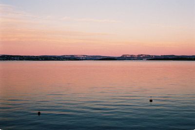 Scenic view of sea at sunset