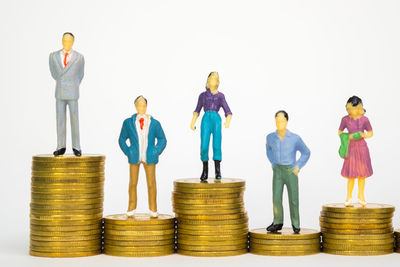 Group of people standing against colored background