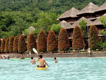 People relaxing in swimming pool