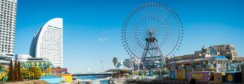 Ferris wheel against blue sky