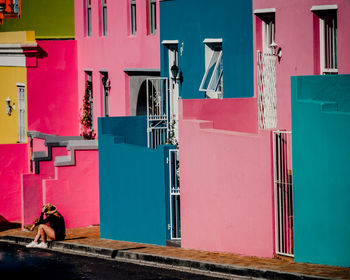 Rear view of man standing by building