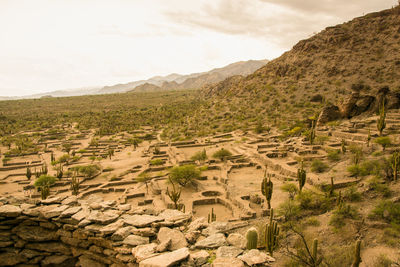 Aerial view of landscape against cloudy sky