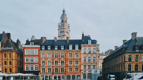 Buildings in city against sky