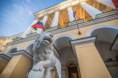 Low angle view of statue against building