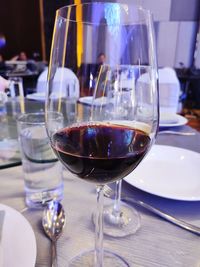 Close-up of wine in glass on table