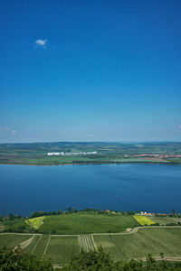 Scenic view of sea against clear blue sky