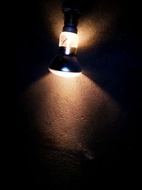 Close-up of illuminated light bulb