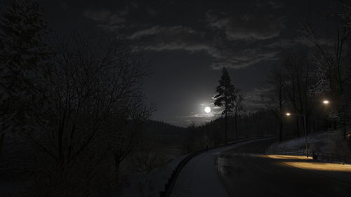 View of illuminated street at night